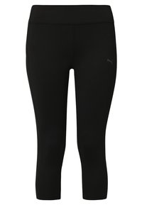 Leggings noirs en tissu stretch, dotés d'une taille haute et d'un petit logo sur la cuisse gauche. Conçus pour les vêtements de sport.