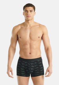 Czarne bokserki z geometrycznym wzorem w ciemnoszarym kolorze, z miękkim paskiem w pasie, dopasowanym krojem i gładką teksturą.