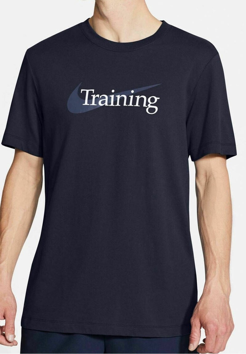 Navy blue cotton t-shirt with short sleeves, featuring a large white "Training" text and a blue Nike swoosh logo on the chest.