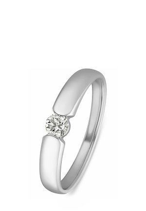 Silberring mit einem glatten, modernen Design und einem runden Diamanten in der Mitte, der ein poliertes Finish und eine elegante Form hervorhebt.