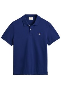 Navy blue polo shirt in cotton material, featuring a classic collar, short sleeves, and a small embroidered logo on the chest.