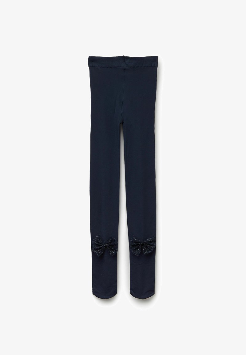 Granatowe legginsy wykonane z miękkiego materiału z dekoracyjnymi kokardkami przy dolnych nogawkach, ozdobione wzorem w kropki. Elastyczny pas.