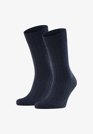 Calcetines de canalé en color navy con un acabado texturizado, que cuentan con un talón y una puntera reforzados, además de un puño superior cómodo para un ajuste seguro.