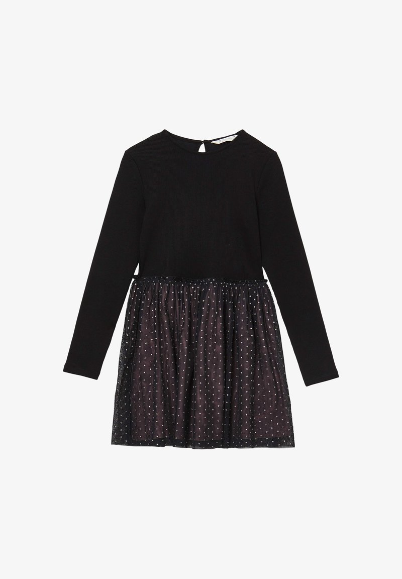 Abito nero a maniche lunghe con top a coste e gonna sovrapposta trasparente con motivi a pois argentati per un tocco di texture e dettaglio.