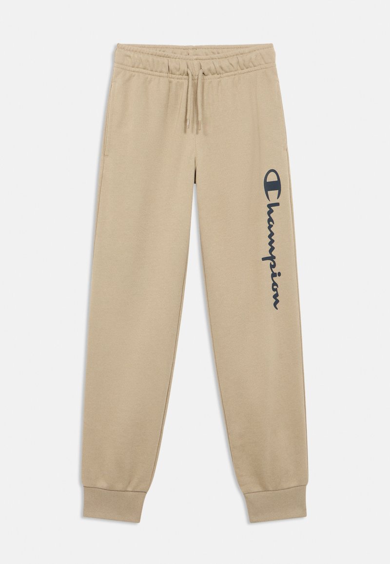 Μπεζ παντελόνι φόρμας από απαλό ύφασμα, με ελαστική μέση, μανσέτες και σκούρο λογότυπο στο αριστερό πόδι.