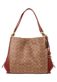 Sac fourre-tout avec un corps en tissu à motif beige, des accents en cuir rouge, des garnitures dorées et deux poignées pour le transport.