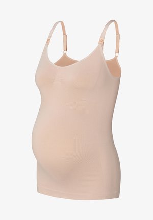 Beige seamless maternity camisole with adjustable straps, designed for comfort and support during pregnancy.