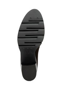 Semelle de chaussure en caoutchouc noir texturé, avec des rainures horizontales et un logo en relief. Les bords sont lisses et la construction est durable.