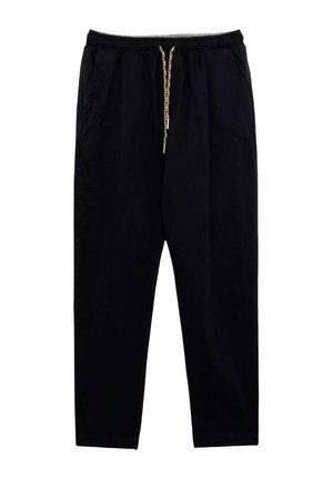 Pantaloni neri leggeri con vita elastica, cordino in cotone, tasche laterali e una vestibilità rilassata che si restringe alla caviglia.