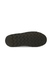 Suela de zapato de goma negra con patrón de zigzag. Acabado suave con ligera textura y nombre de marca embossado en el talón.