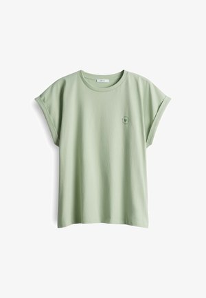 Light green cotton t-shirt with a relaxed fit, rolled short sleeves, and a small circular logo on the left chest.