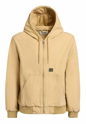 Béžová bunda na zips s kapucňou, prednými vreckami, sťahovacou šnúrkou na kapucni, rebrovanými manžetami a malou značkovou aplikáciou na ľavom vrecku.