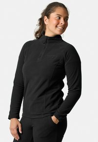Zwarte fleece trui met hoge kraag, halve ritssluiting aan de voorkant en lange mouwen. Glad textuur, aansluitende pasvorm, met subtiele logo-details.