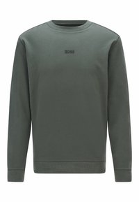 Mörkgrön sweatshirt gjord av mjukt tyg, med rund halsringning, långa ärmar och en liten ton i ton-logotyp på bröstet.