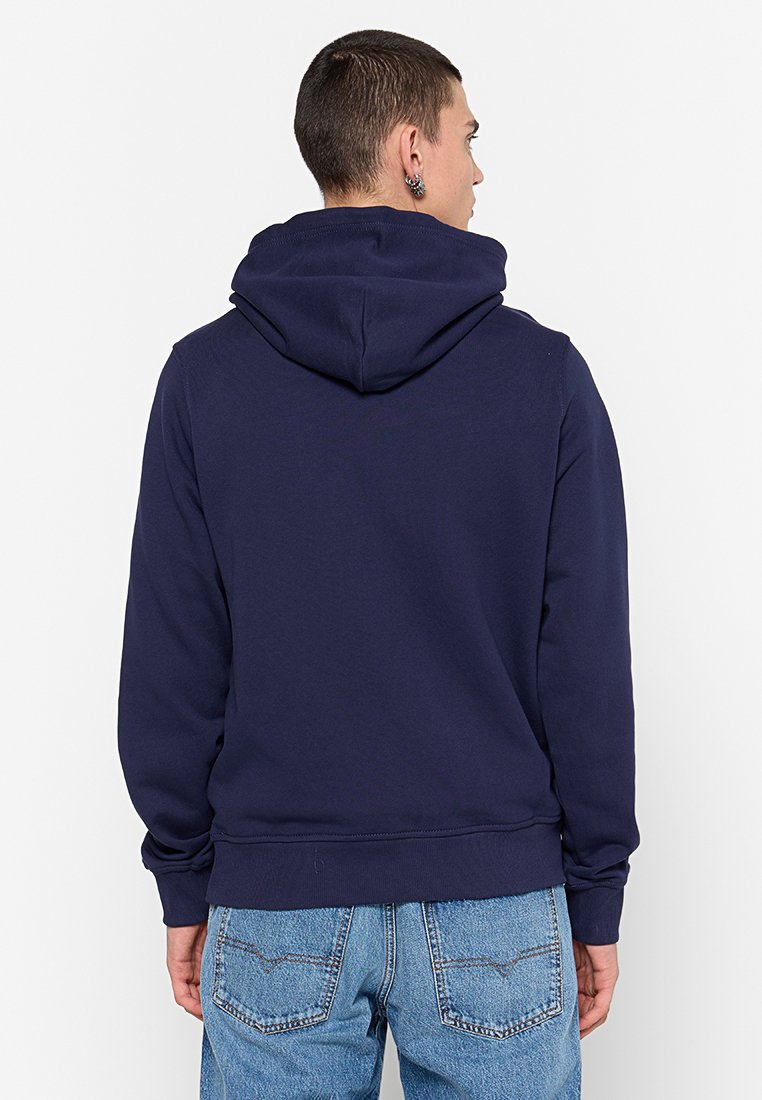 Haut à capuche bleu marine avec cordon de serrage, en coton doux, avec des poignets et une taille côtelés, offrant une coupe décontractée et un design uni.