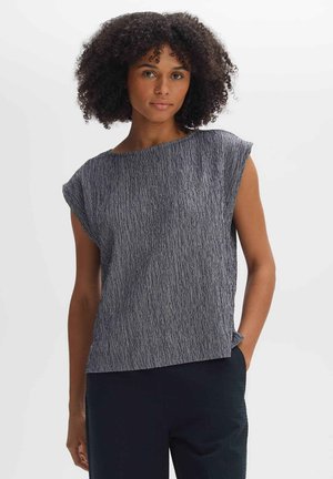 Navy textured blouse with wide, cap sleeves and a boat neckline. Fabric has a subtle striped pattern; relaxed fit with a straight hem.