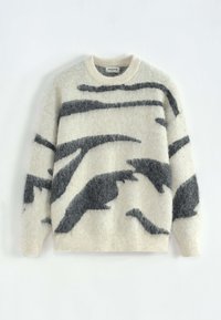 Pull crème clair en tissu duveteux, avec motifs abstraits en gris foncé, col rond, poignets et ourlet côtelés.