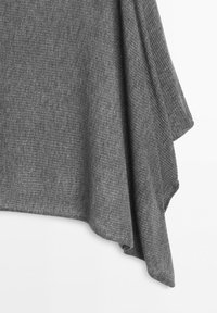 Gray ribbed knit fabric drapes asymmetrically with a soft texture, showing folds and a slightly curved hem against a white background.