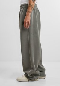 Karl Kani KK OS SIDESTRIPE - Trousers - grey