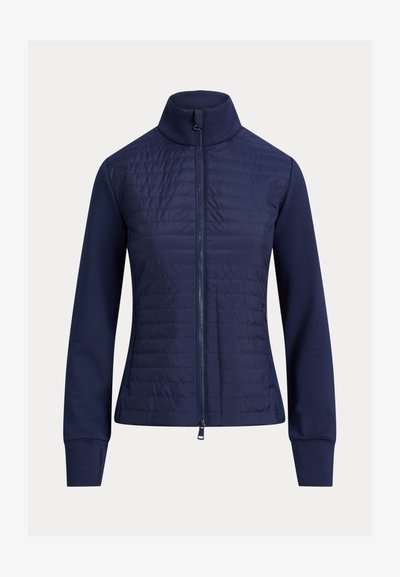 Ναυτικό μπουφάν με φερμουάρ μπροστά, με επένδυση καπιτονέ στο πάνω μέρος και λείο, ελαστικό ύφασμα στα μανίκια και στο κάτω μέρος.