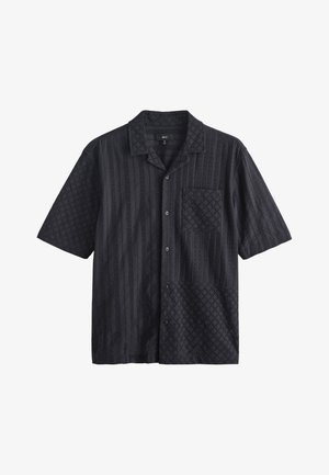 Black short-sleeve button-up shirt with patterned textured fabric, a collar, and a left chest pocket.