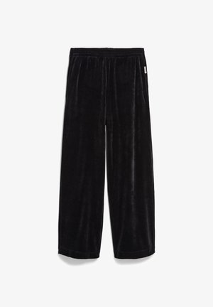 Zwarte wijde velours broek met een elastische tailleband, relaxte pasvorm en zijzakken, weergegeven op een witte achtergrond.