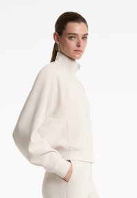 OYSHO SOFT TOUCH HIGH COLLAR STRIPED - Zip-up sweatshirt - sand