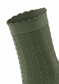 Zielona skarpetka o teksturowanej powierzchni z prążkowanym wykończeniem i falbaniastym brzegiem. Posiada tkany wzór na całej powierzchni, prezentując miękki i elastyczny materiał.