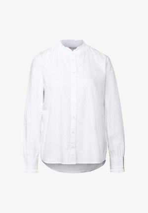 Chemise blanche à manches longues en coton avec un col en dentelle, fermeture à boutons et poignets froncés, présentant un ourlet arrondi et une coupe décontractée.