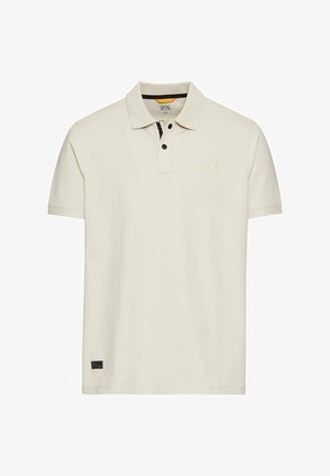 Cream polo shirt made of cotton, featuring a two-button placket, short sleeves, and a subtle logo patch on the chest.