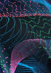 Multicolored fabric featuring a black base with vibrant dot patterns in blue, pink, green, and red, arranged in swirling shapes.