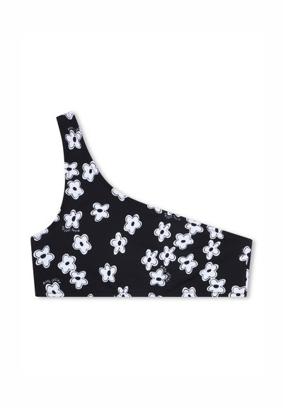 Bralette noire à une bretelle, ornée d'un motif floral blanc. Texture lisse avec le nom de la marque imprimé sur le côté.