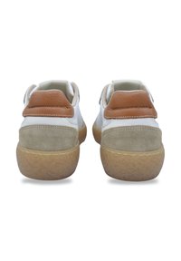 White sneakers with a tan leather heel tab, grey suede accents, and a textured rubber sole. Features contrasting materials and stitching.