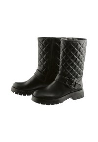Pair of black mid-calf boots with quilted upper panels, side zipper, chunky soles, and a strap with a decorative buckle around the ankle.