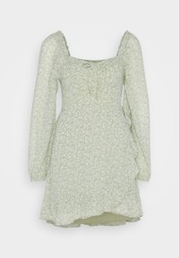 Ljust grön blommig omslagsklänning med långa puffärmar, fyrkantig halsringning, knytdetalj och volangkant.