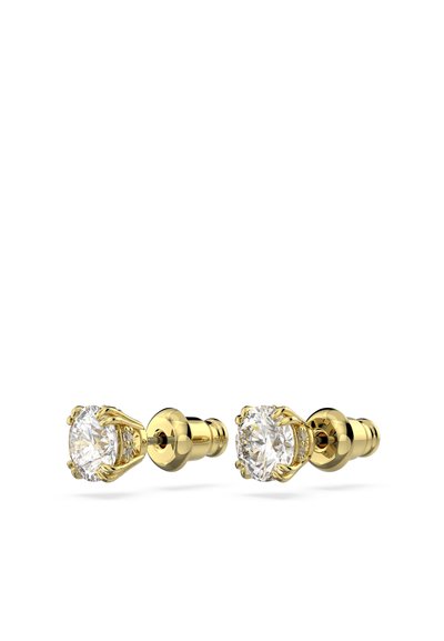 Boucles d'oreilles en or avec des pierres claires taillées en rond en sertissage griffes, finition métallique lisse et apparence polie.