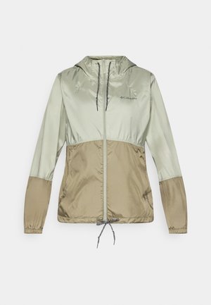 Lengvas gobtuvėlis šviesiai žaliai ir rusvai atspalvių, su elastiniais rankogaliais, priekyje užtrauktuku ir reguliuojamu raiščiu apačioje.