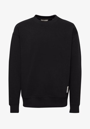 Black crewneck sweatshirt made of soft fabric, featuring ribbed cuffs and hem, with a small label on the side near the bottom.