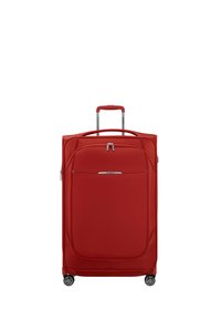 Red suitcase with a smooth fabric exterior, retractable handle, and four wheels. Features a front zip pocket and accent hardware.