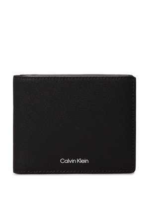 Portefeuille bifold noir en cuir lisse avec des coutures visibles. Présente un logo "Calvin Klein" blanc en bas à l'avant. Design compact.