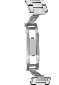 Bracelet de montre en acier inoxydable avec finitions brossées et polies. Dispose de maillons s'emboîtant et d'un mécanisme de fermoir pour un port sécurisé.