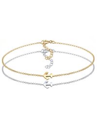 Guld- och silverfärgade ankaretsarmband med delikata kedjor, som har kräftkrok och justerbar längd, slät yta och minimalistisk design.