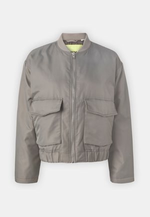 Gray bomber jacket with a zip closure, ribbed collar, two front flap pockets, and elastic hem. Lined with bright yellow fabric.