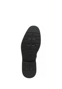 Suela de zapato negra con un patrón de agarre texturizado y acentos rectangulares. Presenta el nombre de la marca "WITTCHEN" grabado cerca del área del talón.