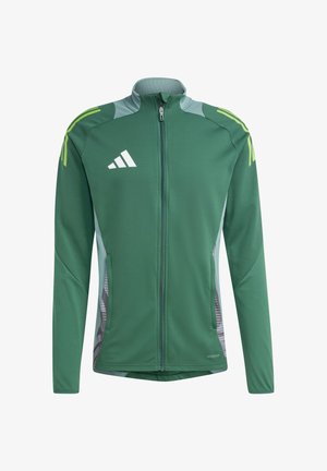 Grüne Sportjacke mit durchgehendem Reißverschluss, kontrastierenden hellgrauen Akzenten und gemusterten Seitenpanelen. Mit dem Adidas-Logo auf der Brust.