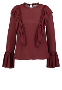 Blouse bordeaux à manches longues avec panneaux froncés sur le devant et aux épaules, poignets évasés, et petite fermeture bouton œillet au niveau de l'encolure.