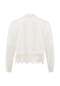 Witte lange mouw shirt met een bloemenkant trim aan de onderkant. Gladde textuur en klassiek kraagontwerp. Knopen op de mouwen.