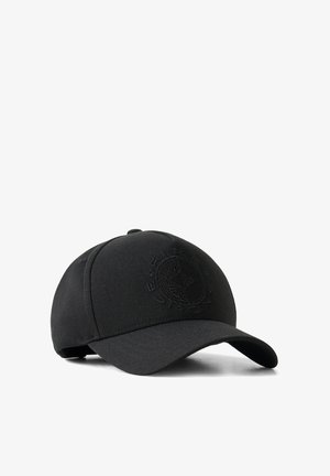 Black baseball cap with a curved brim and an embossed circular emblem on the front panel, displayed on a white background.