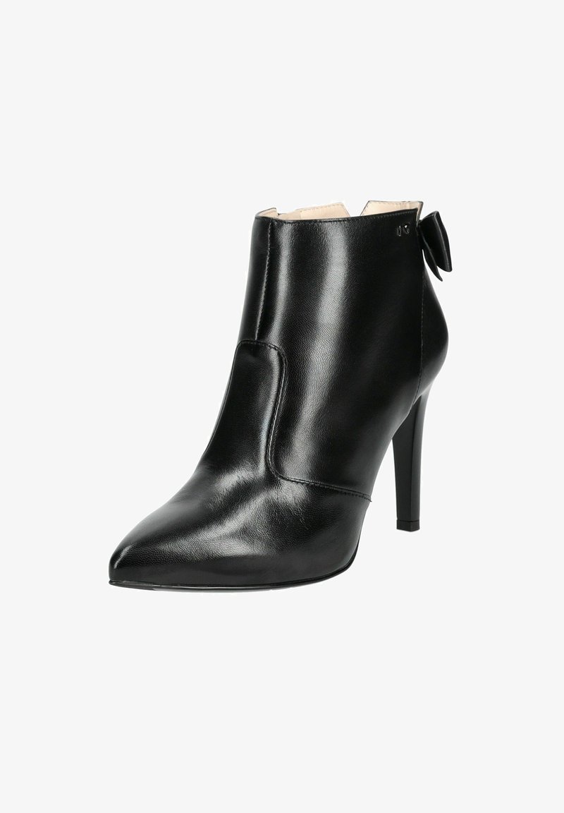 Black leather ankle boot with a pointed toe and a high stiletto heel. Notable details include a cut-out design and a bow accent at the back.