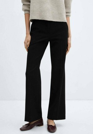 Black, wide-leg trousers with a smooth texture, mid-rise waist, subtle pleats, and minimal detailing. Paired with dark maroon loafers.